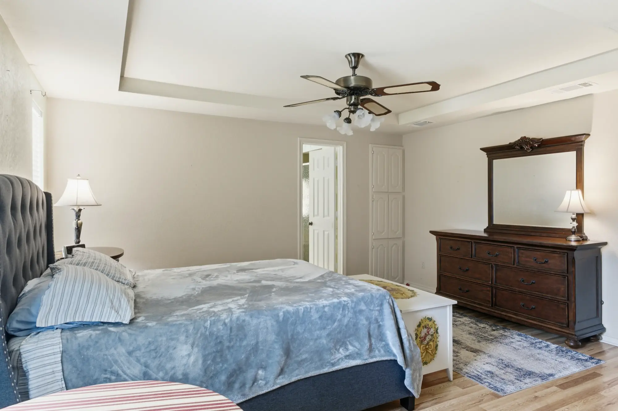 Primary bedroom with tray ceiling
